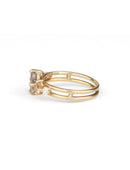 Five stone ring with grey oval sapphire, two peach sapphires and two white diamonds. 18ct yellow gold, satin finish. Side view.