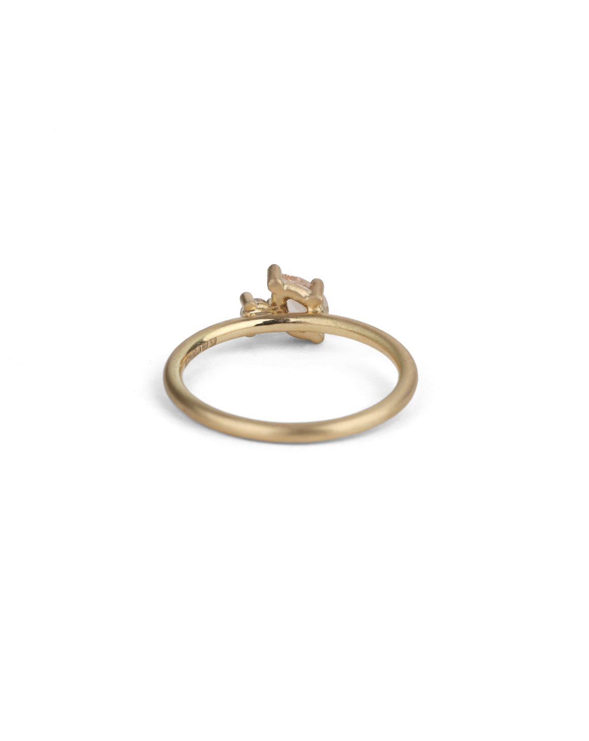 Two stone ring with teardrop shape peach sapphire and round white diamond. 18ct yellow gold, satin finish. Back view.