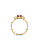 Three stone ring with a pink oval sapphire and two white diamonds. 18ct yellow gold, satin finish. Side view.
