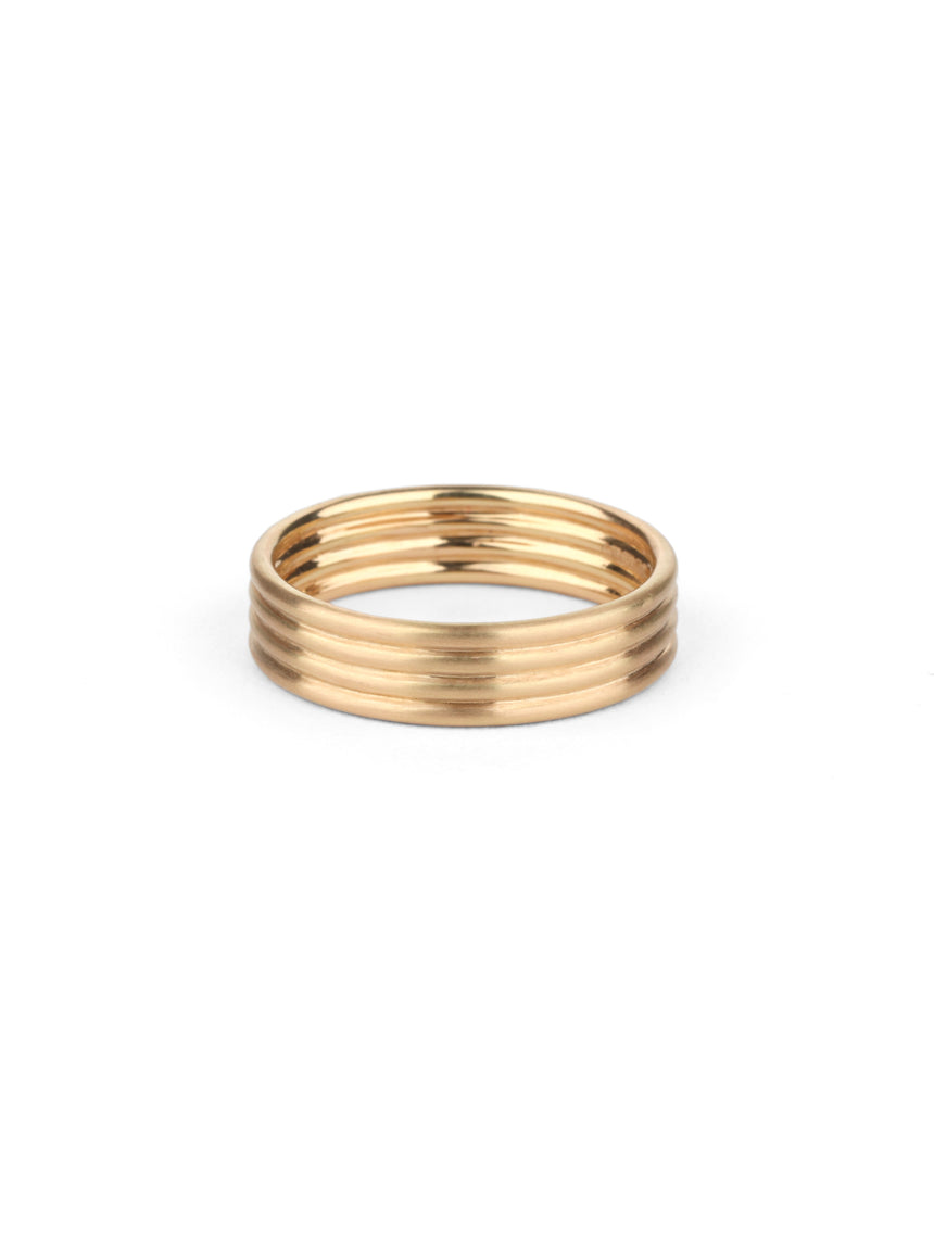 Wedding ring, four joined bands. 18ct yellow gold, satin finish.