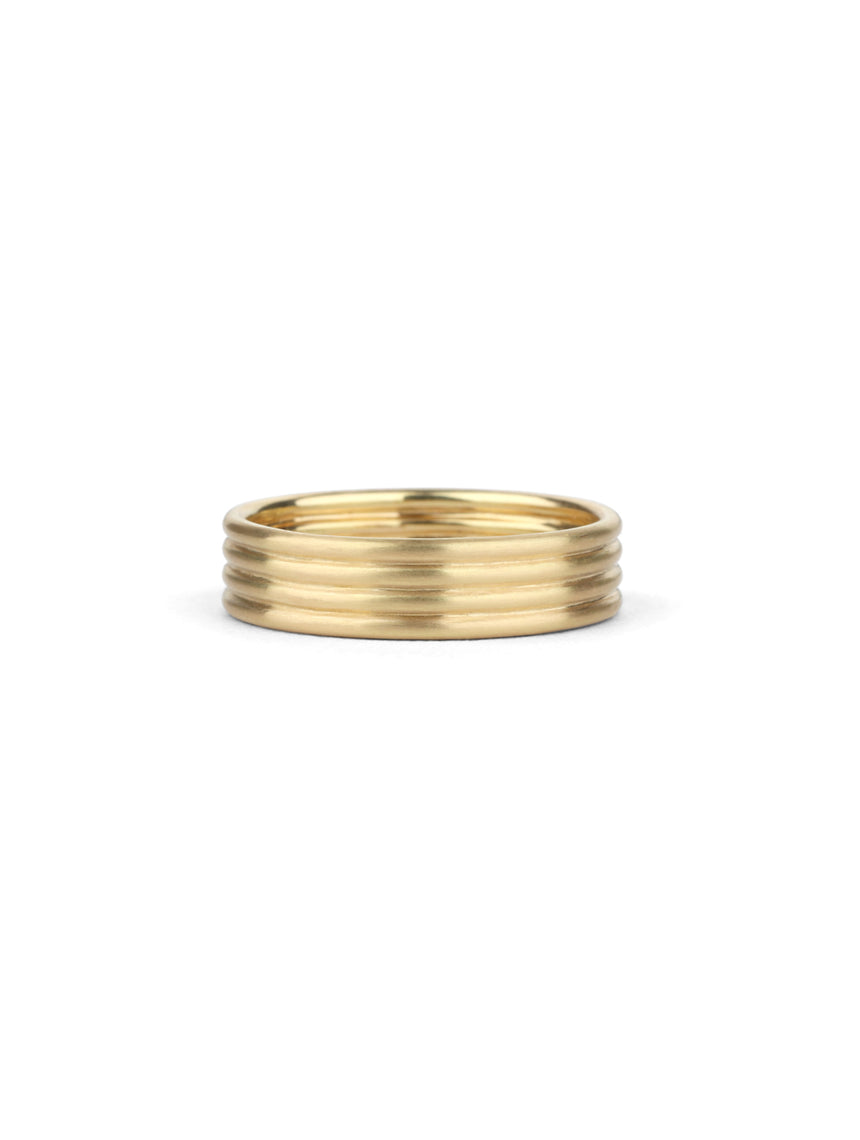 Wedding ring, four joined bands. 18ct yellow gold, satin finish.