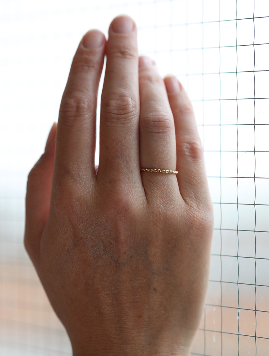 Rope style ring.  18ct yellow gold, satin finish. On hand