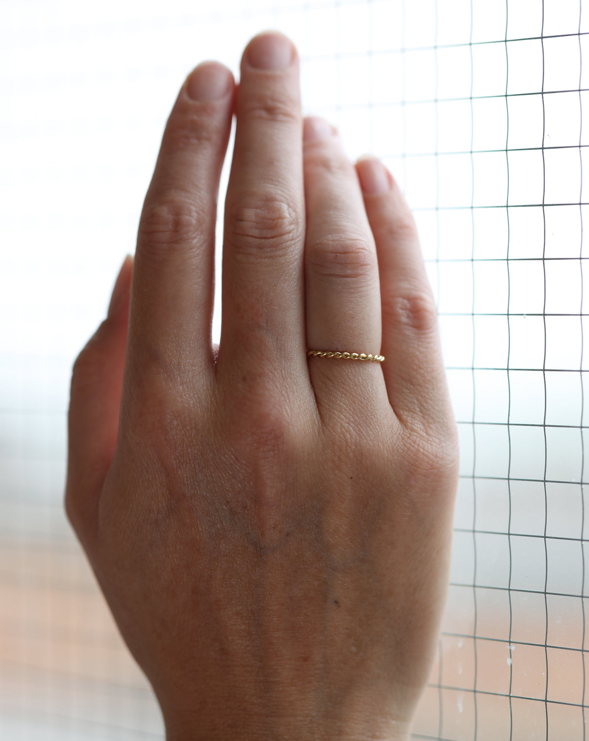 Rope style ring.  18ct yellow gold, satin finish. On hand