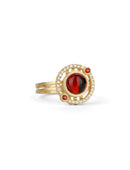 Geometric ring with red garnet and two orange sapphires and a diamond circular surround. 18ct yellow gold, textured finish.