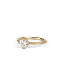 Solitaire ring with round white diamond, four claw setting. 18ct yellow gold, satin finish.
