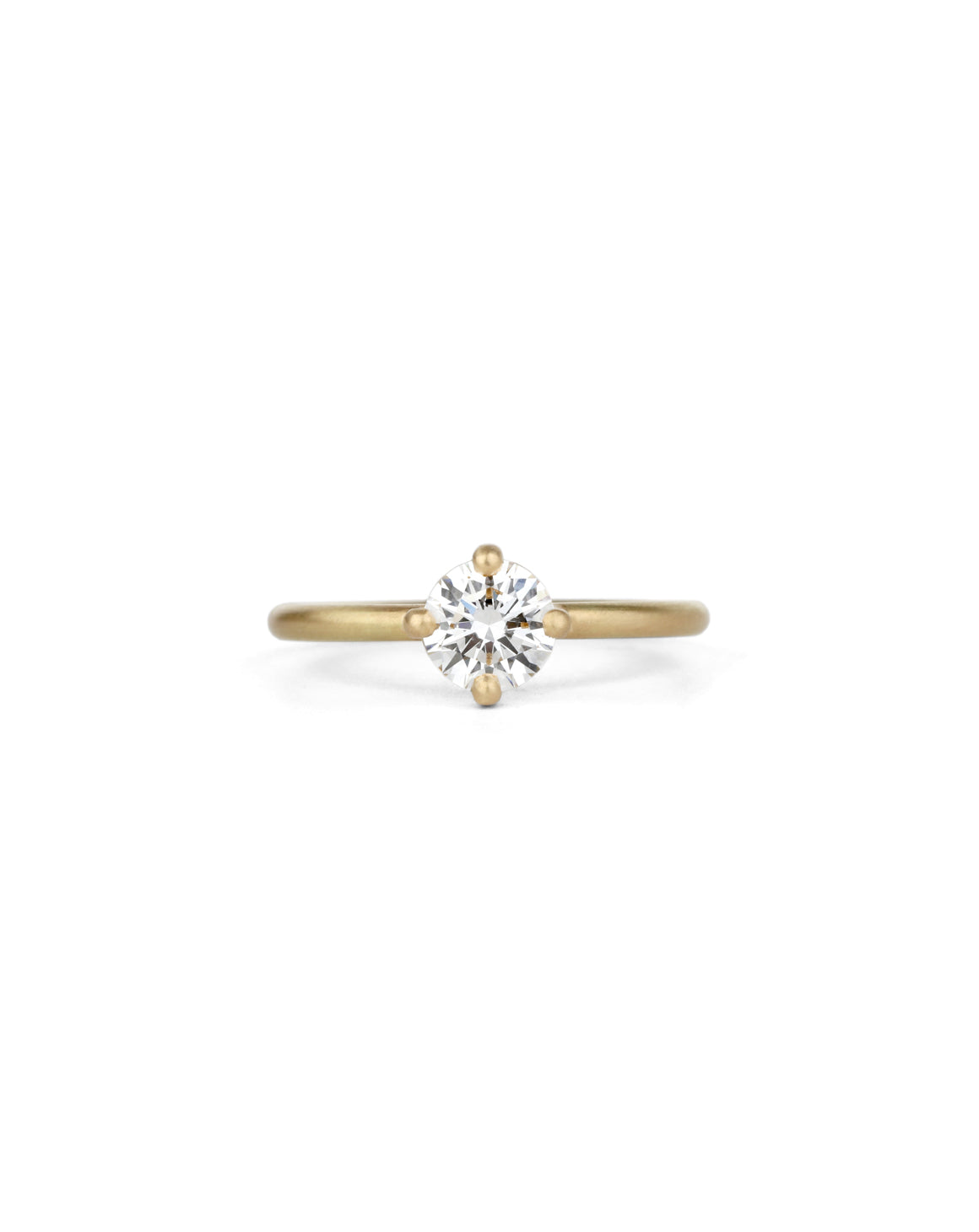 Solitaire ring with round white diamond, four claw setting. 18ct yellow gold, satin finish.