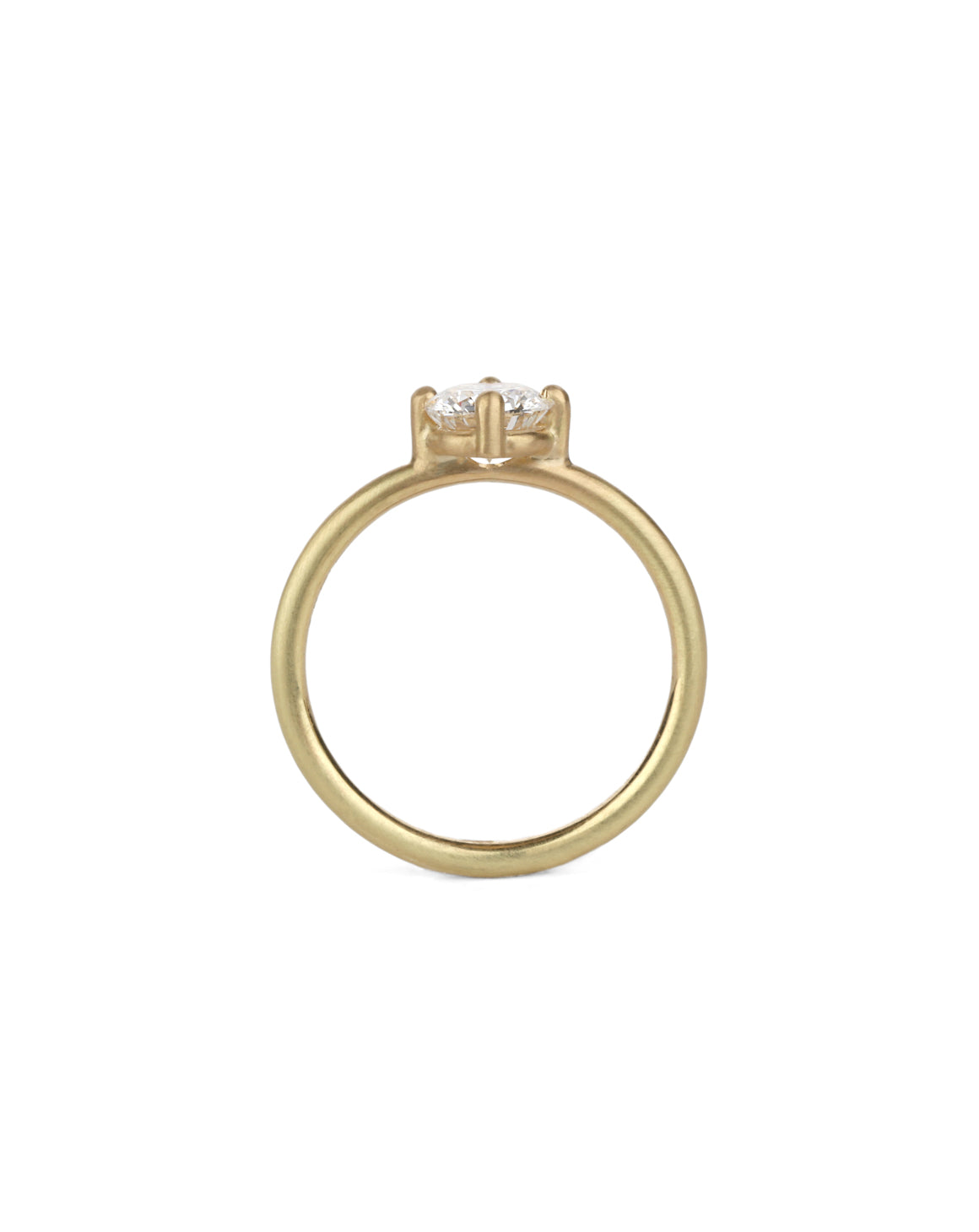 Solitaire ring with round white diamond, four claw setting. 18ct yellow gold, satin finish. Side view.