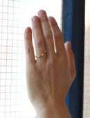 Flat wedding band. 18ct yellow gold, satin finish. On hand.
