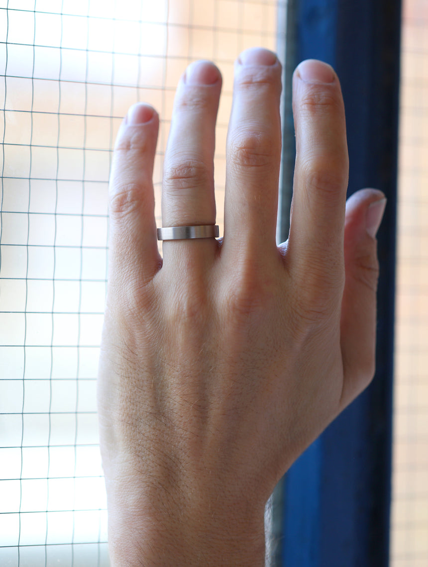 Flat wedding band. 18ct white gold, satin finish.