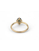 Solitaire ring with oval teal sapphire. 18ct yellow gold, satin finish. Back view.