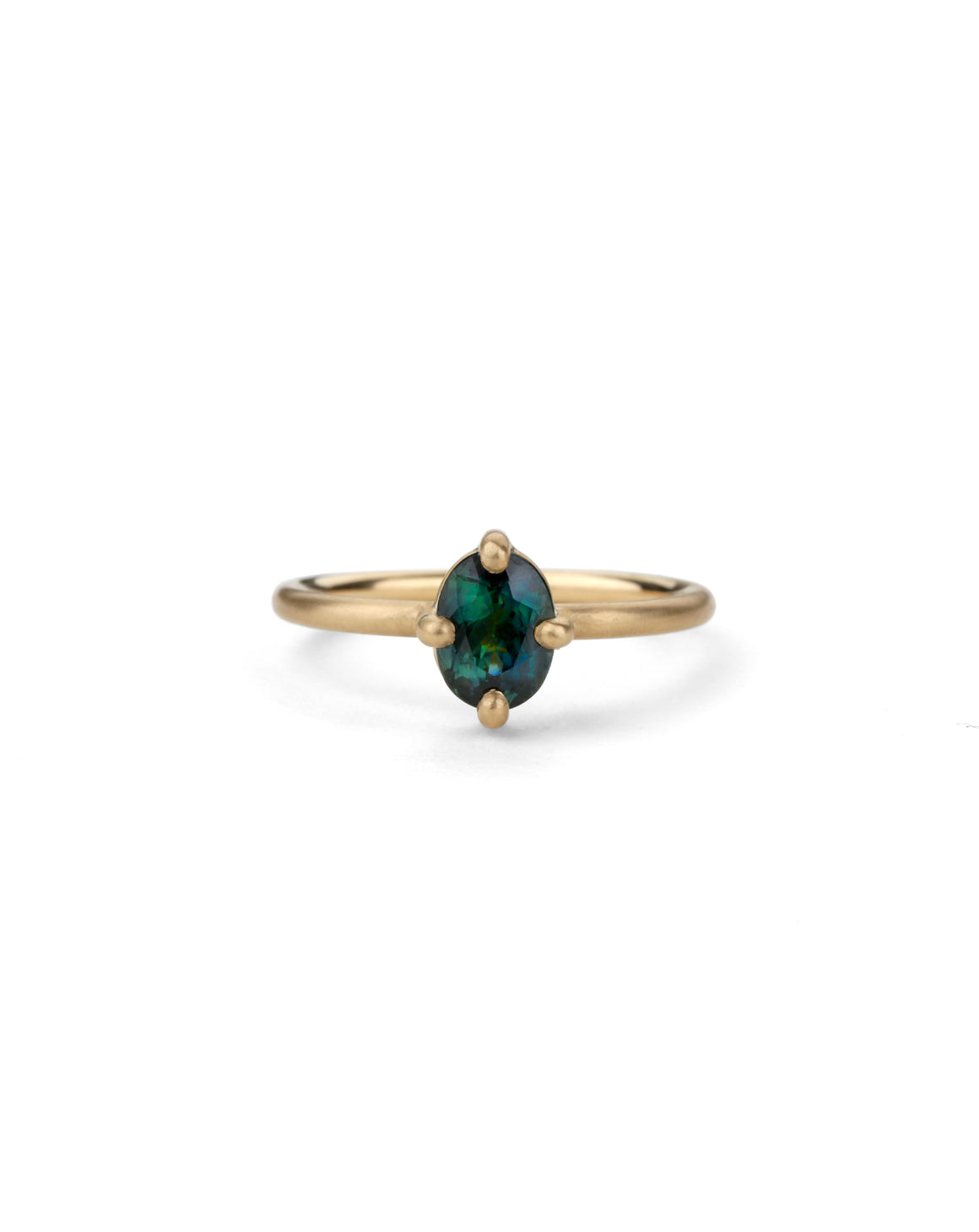 Solitaire ring with oval teal sapphire. 18ct yellow gold, satin finish.