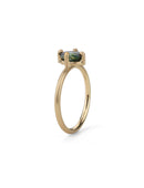 Solitaire ring with oval teal sapphire. 18ct yellow gold, satin finish. Side view.