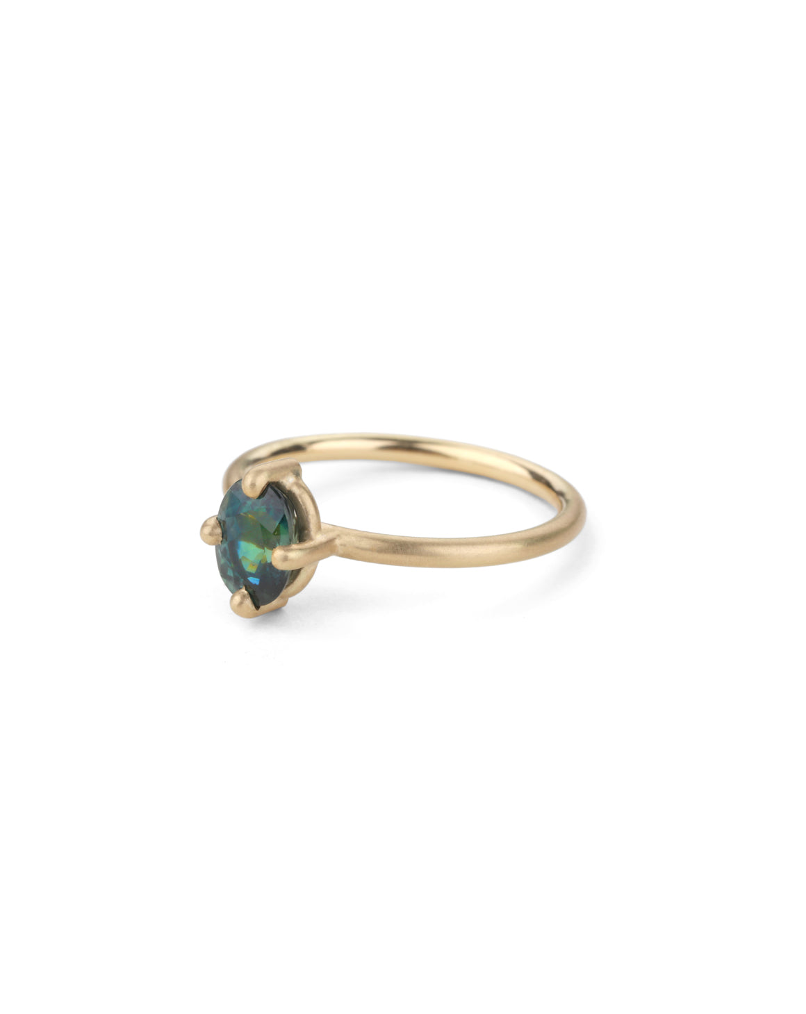 Solitaire ring with oval teal sapphire. 18ct yellow gold, satin finish.