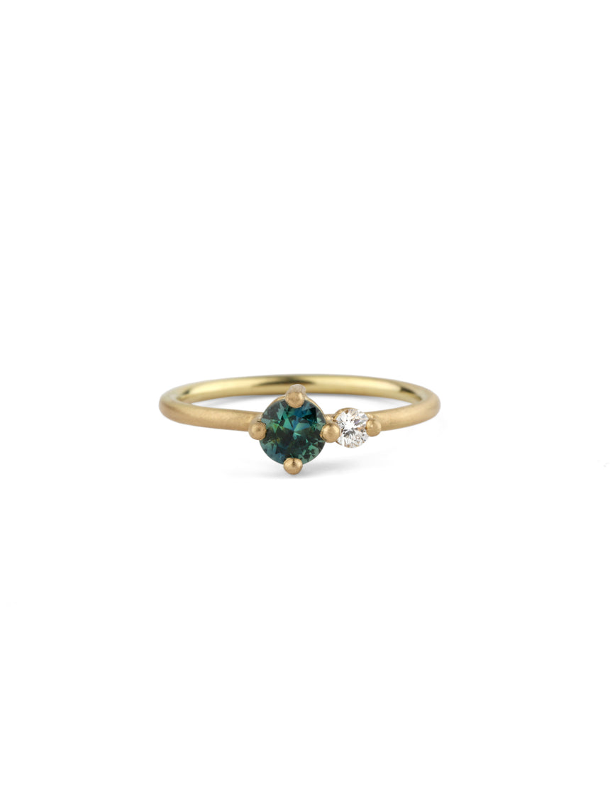 Two stone ring, teal sapphire and white diamond. 18ct yellow gold, satin finish.