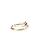 Solitaire ring with round teal sapphire. 18ct yellow gold, satin finish. Back view.