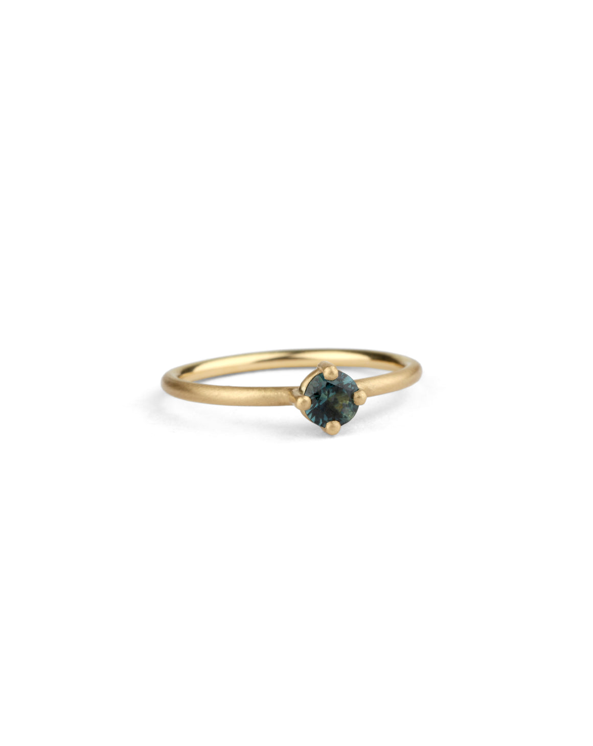 Solitaire ring with round teal sapphire. 18ct yellow gold, satin finish.