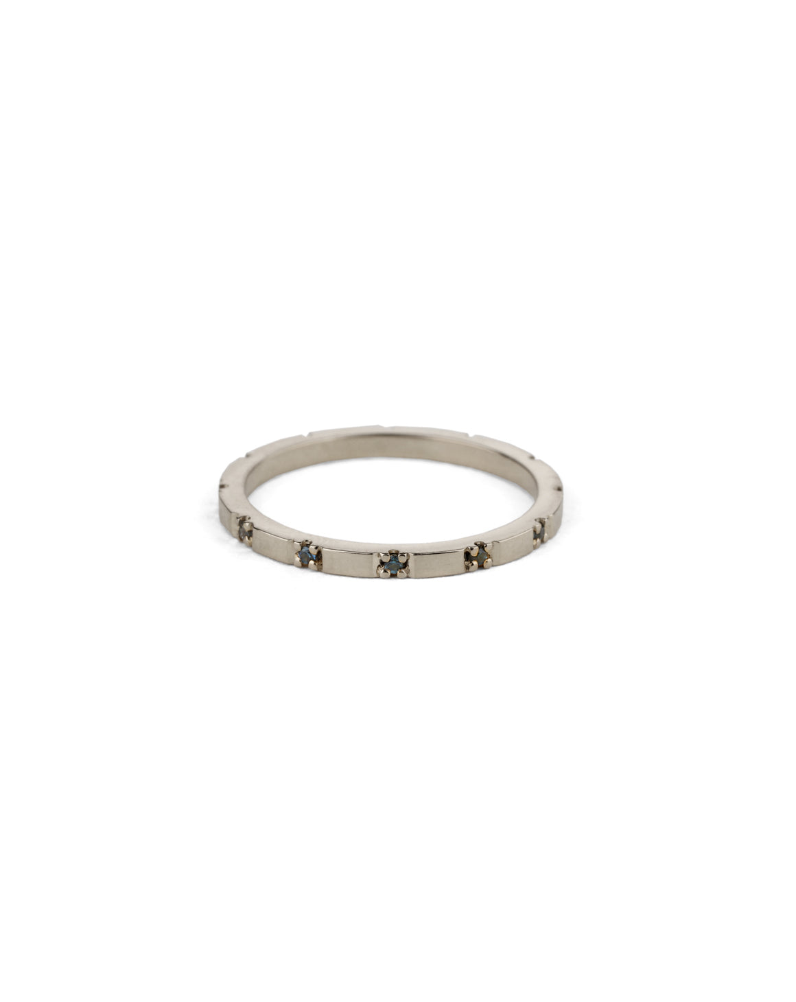 Fine band with tiny teal sapphires. 18ct white gold, polished finish.