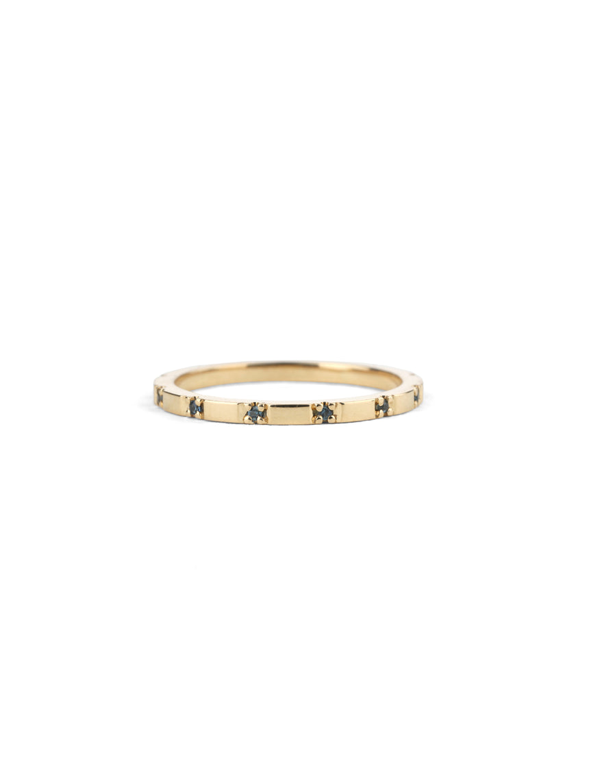 Fine band with tiny teal sapphires. 18ct yellow gold, polished finish.