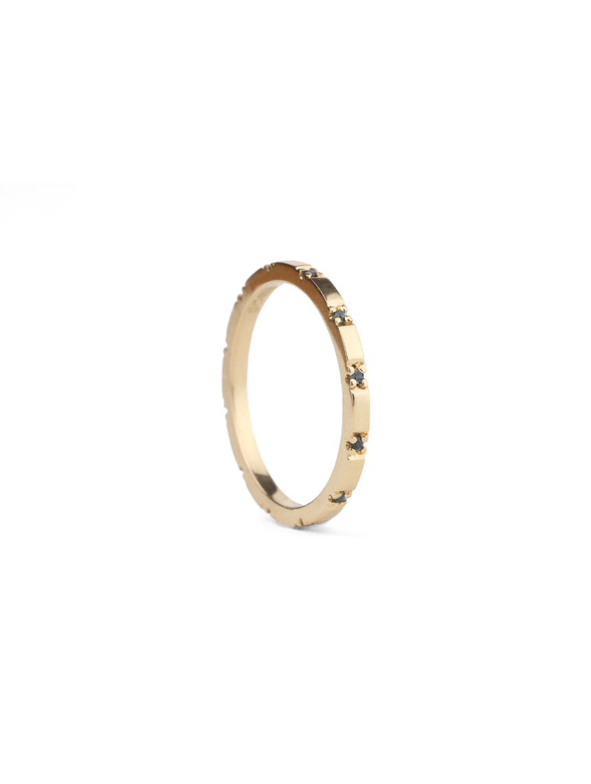 Fine band with tiny teal sapphires. 18ct yellow gold, polished finish.