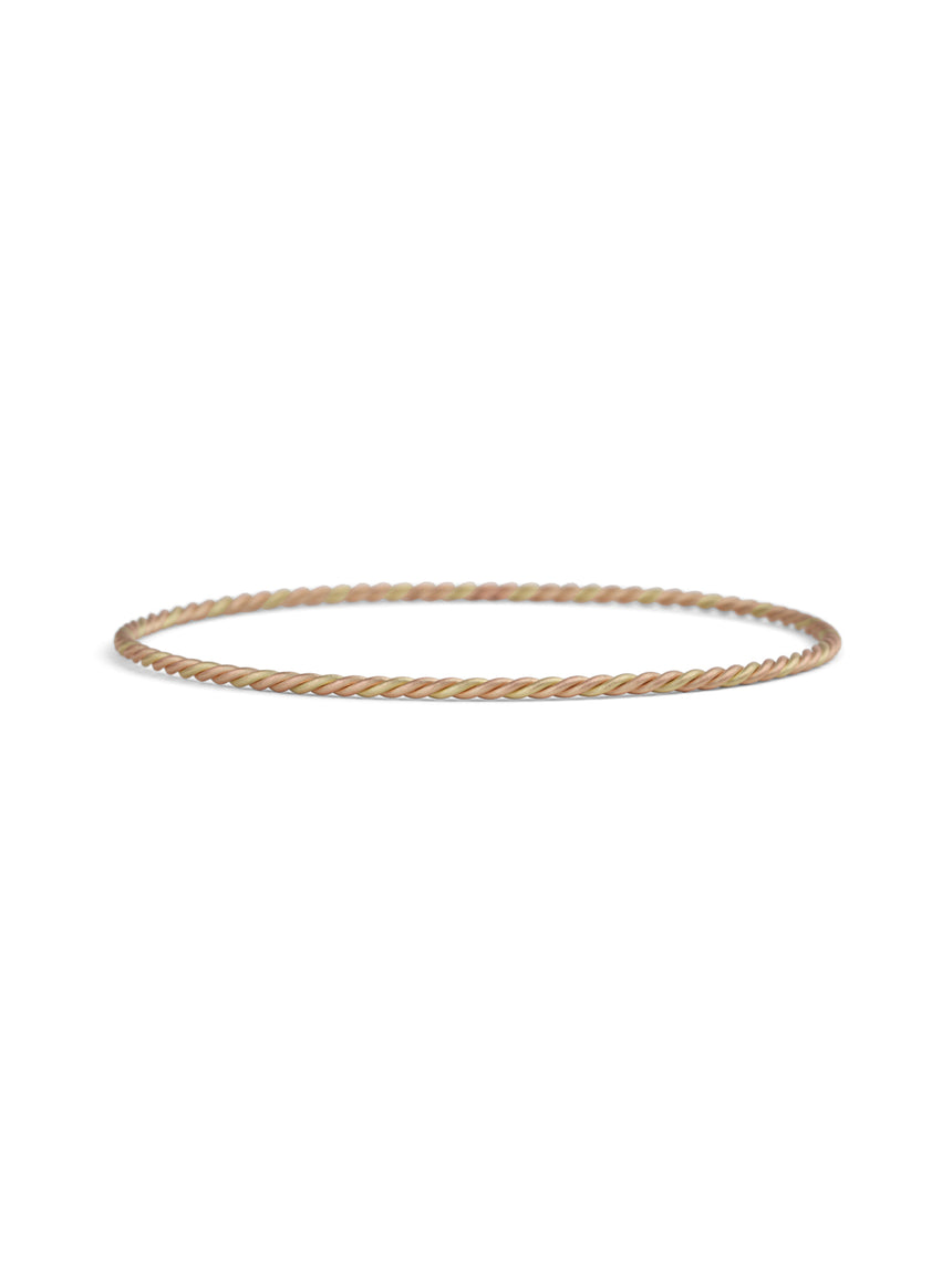 Rope style bangle with a mix of 18ct yellow and rose gold. 
