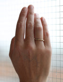 Rope style ring in 18ct yellow gold, satin finish. On hand.
