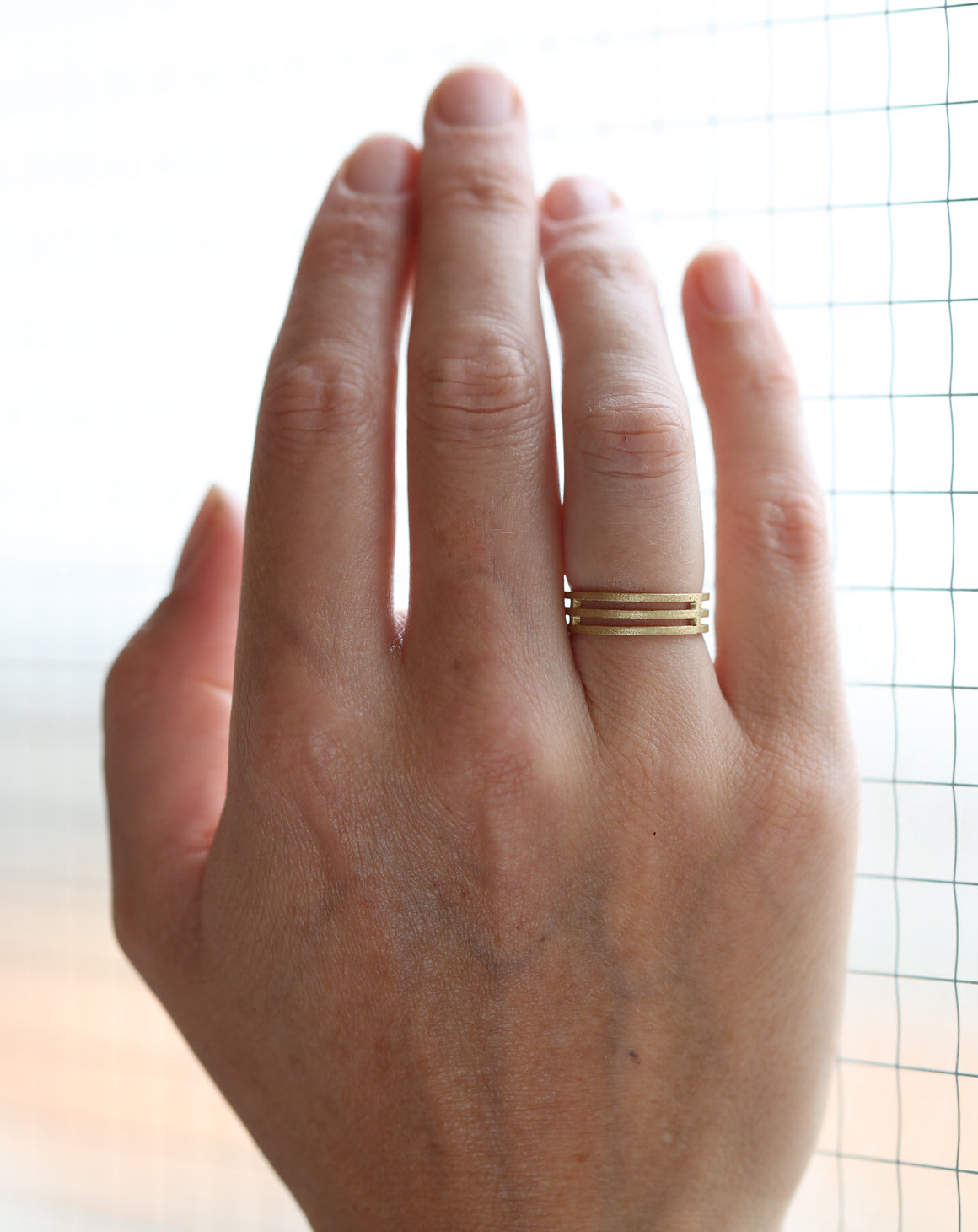 Three band wide wedding ring in 18ct yellow gold, textured finish.