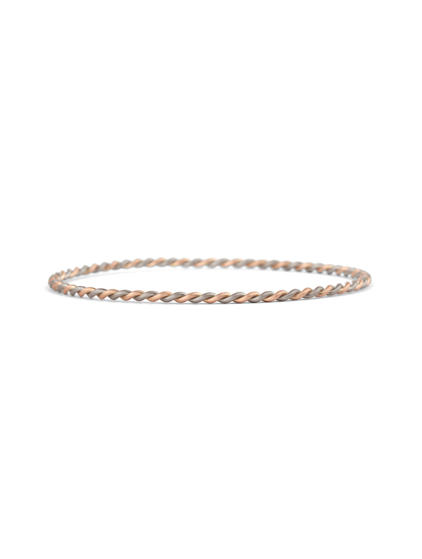 Rope style bangle bracelet.  18ct white and rose gold, satin finish.