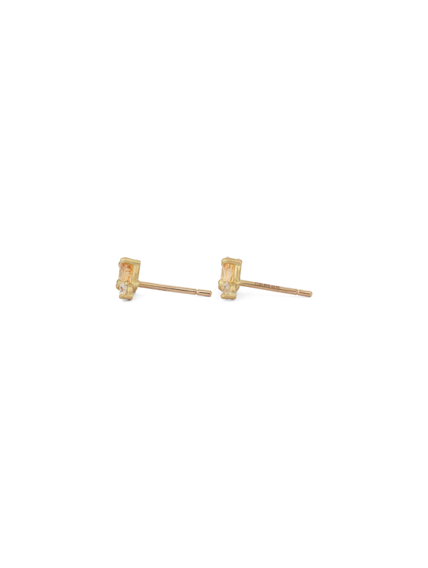 Stud earrings with oval yellow sapphires and white diamonds. 18ct yellow gold, satin finish. Side view.