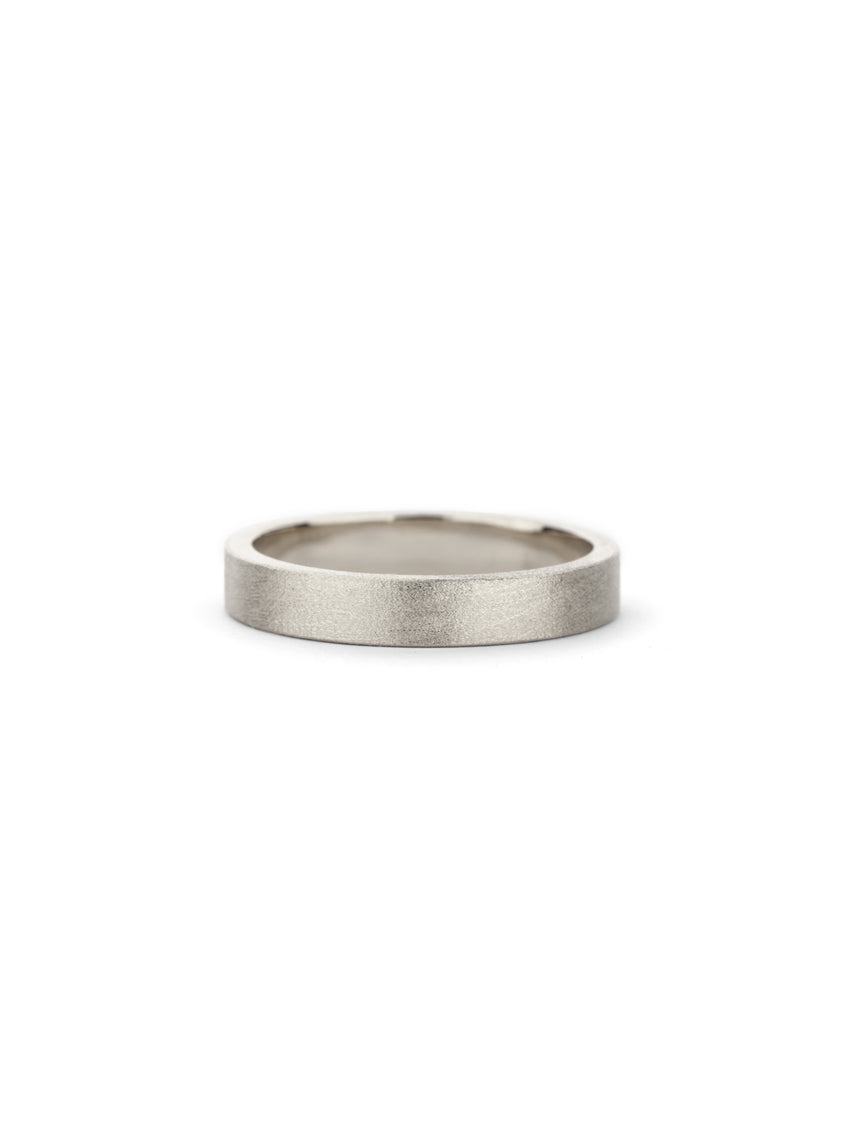 Flat wedding band. 18ct white gold, textured finish.