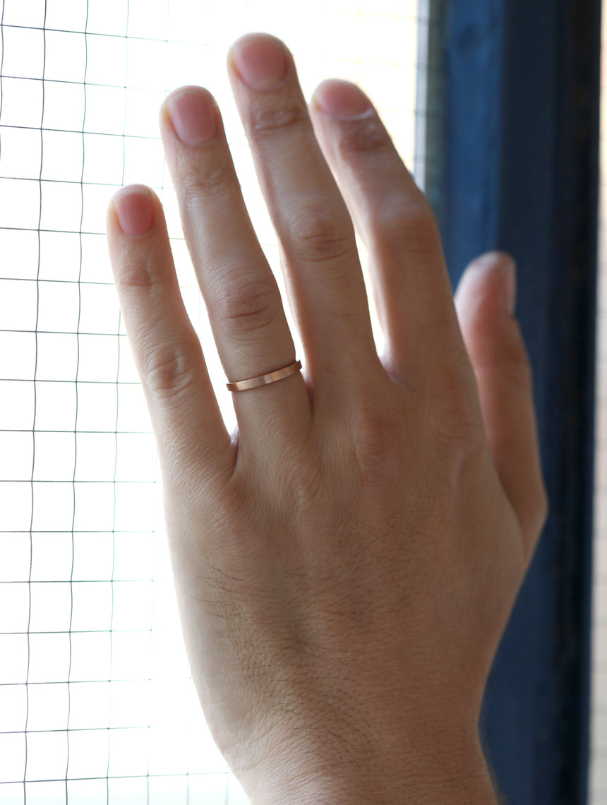 Flat wedding band. 18ct yellow gold, satin finish. On hand.