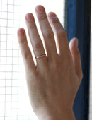 Flat wedding band. 18ct yellow gold, satin finish. On hand.