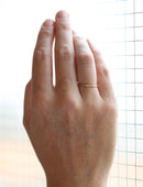 Flat wedding band. 18ct yellow gold, textured finish. Side view.