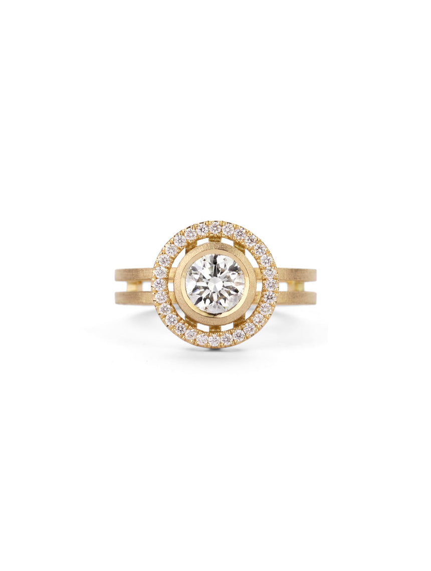 Diamond halo ring in with double band. 18ct yellow gold with textured finish.