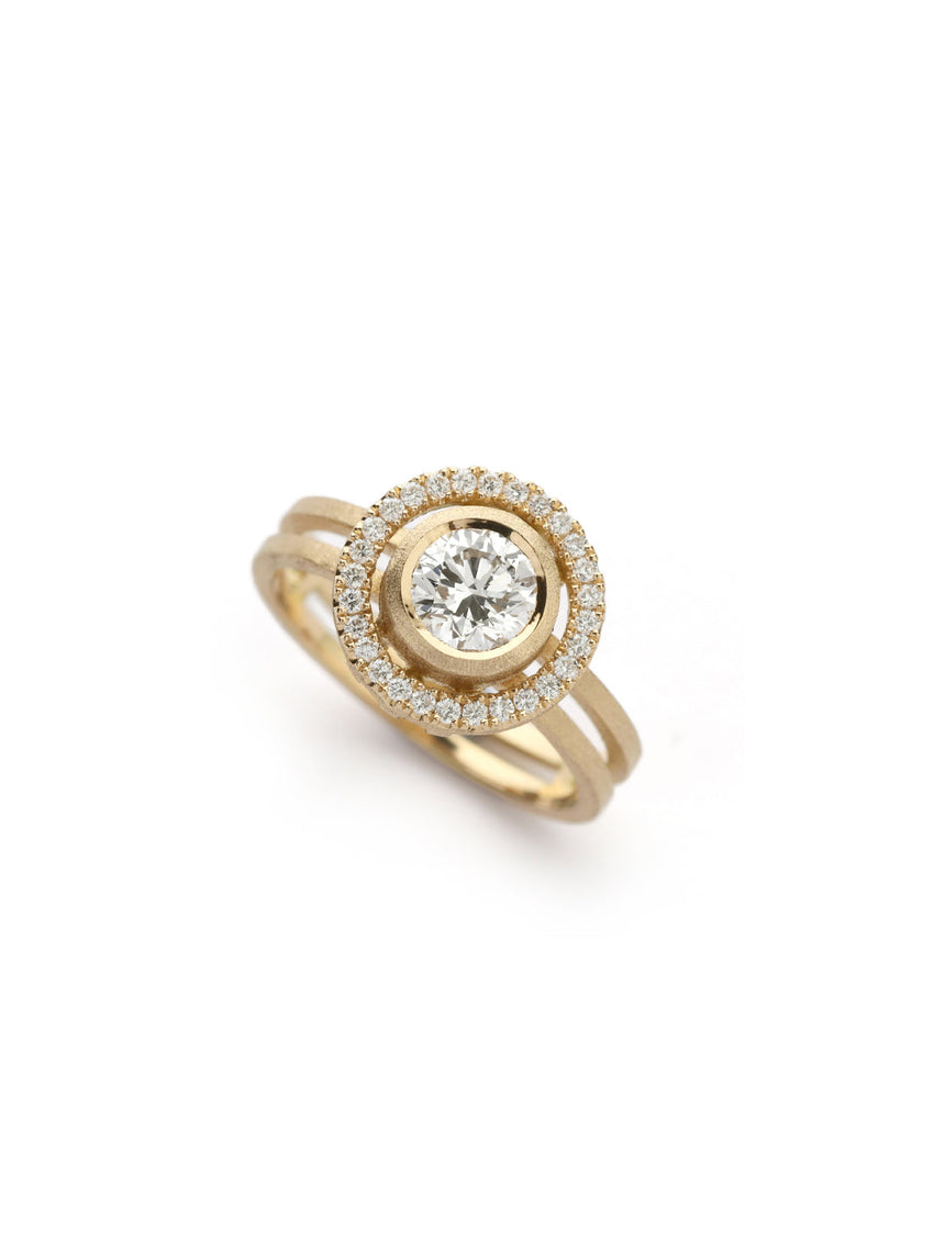 Diamond halo ring in with double band. 18ct yellow gold with textured finish.
