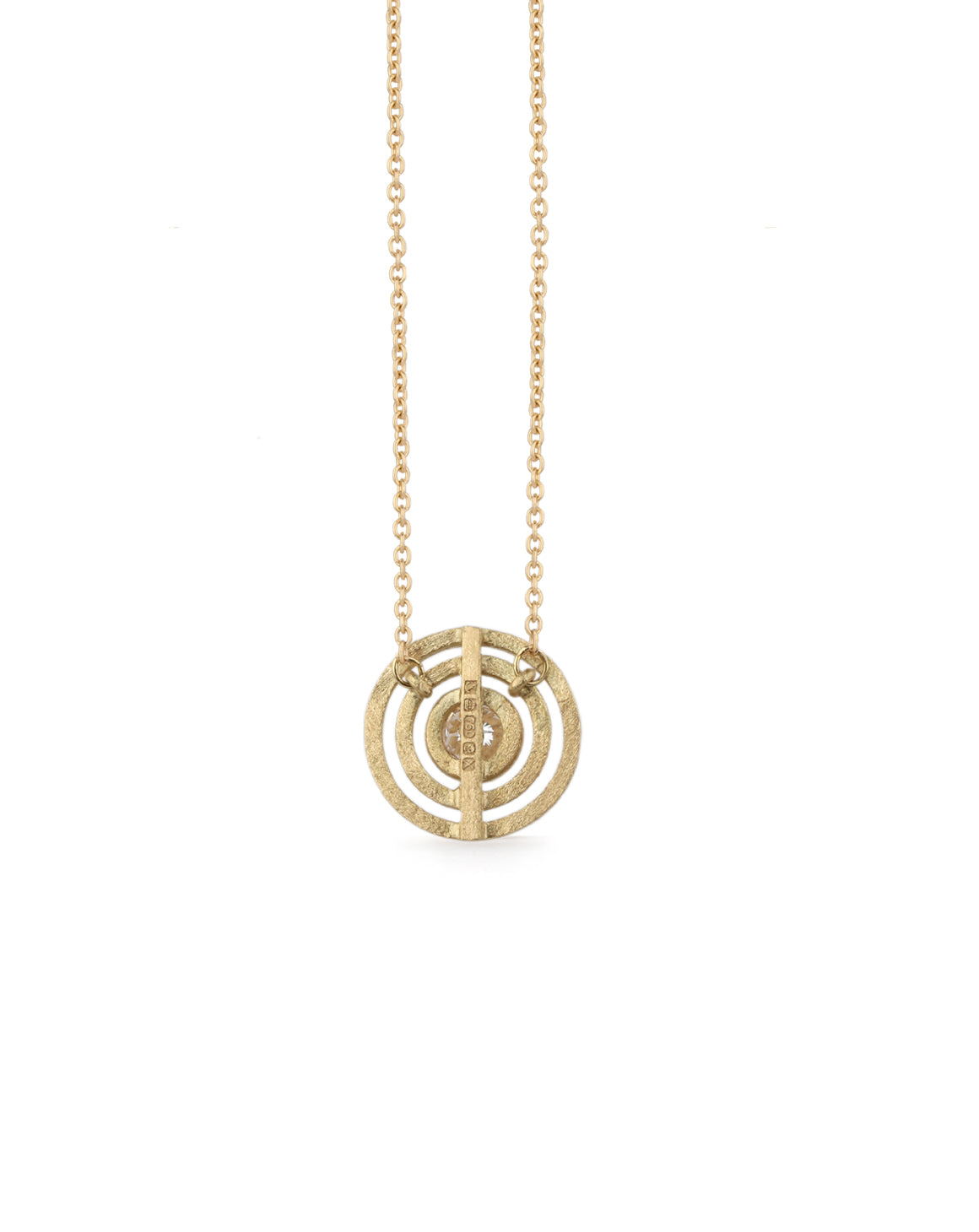 Geometric pendant with concentric circle detail, with central diamond. 18ct yellow gold, textured gold. Back view.