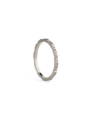 Fine ring band set with tiny white diamonds. 18ct white gold, textured finish.