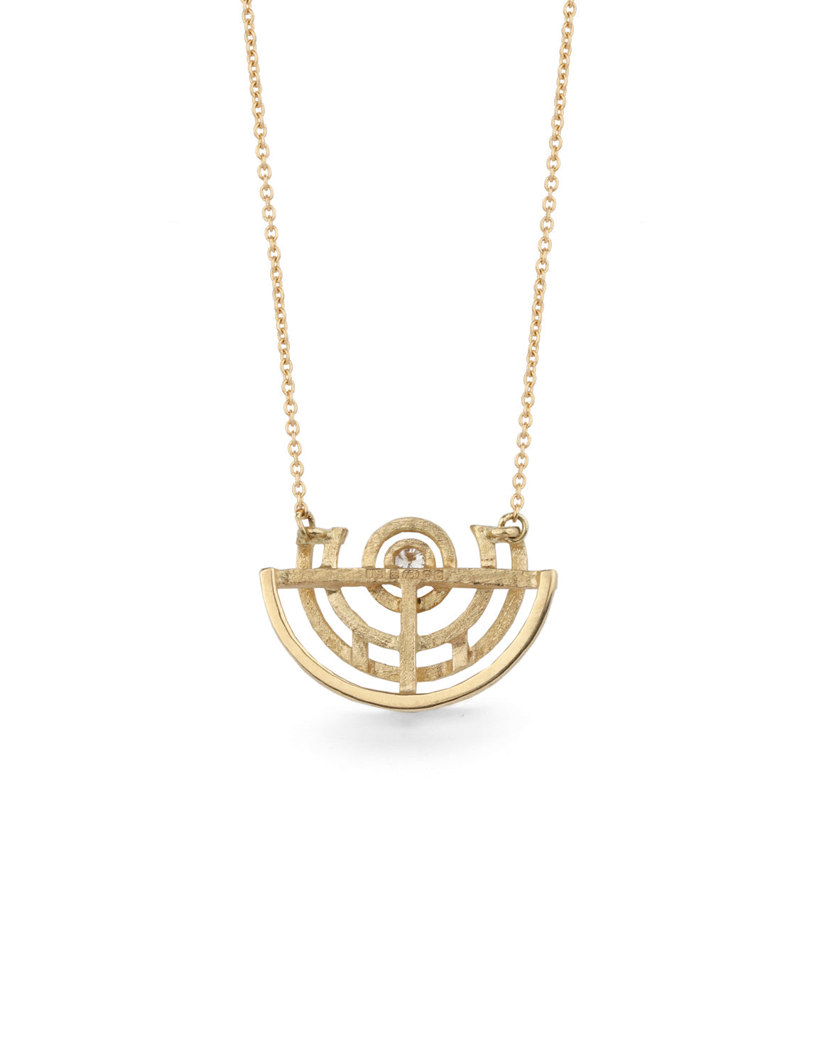 Geometric pendant with semicircular detail and central white diamond. 18ct yellow gold, textured finish. Back detail.