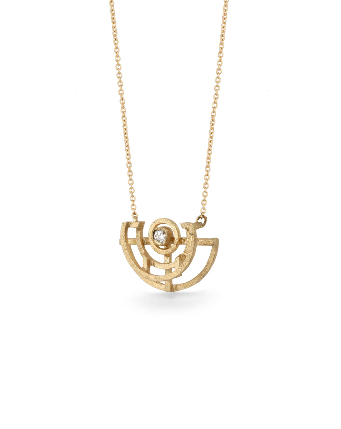 Geometric pendant with semicircular detail and central white diamond. 18ct yellow gold, textured finish. Side detail.