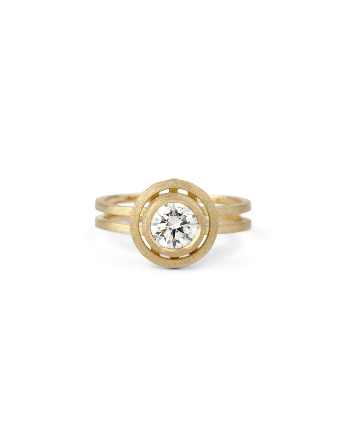 Geometric solitaire ring with circular detail and double band. 18ct yellow gold, textured gold.