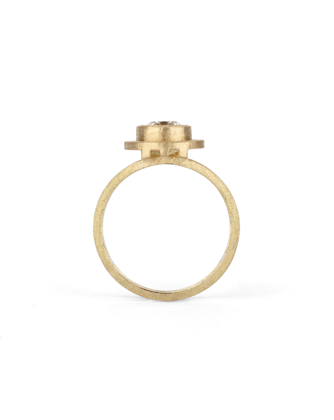 Geometric solitaire ring with circular detail and double band. 18ct yellow gold, textured gold. Side view.