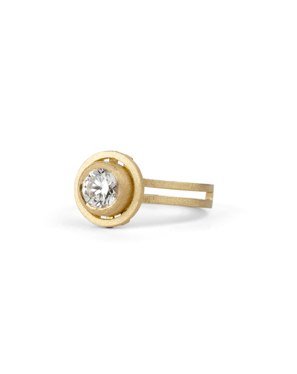 Geometric solitaire ring with circular detail and double band. 18ct yellow gold, textured gold. Side view.