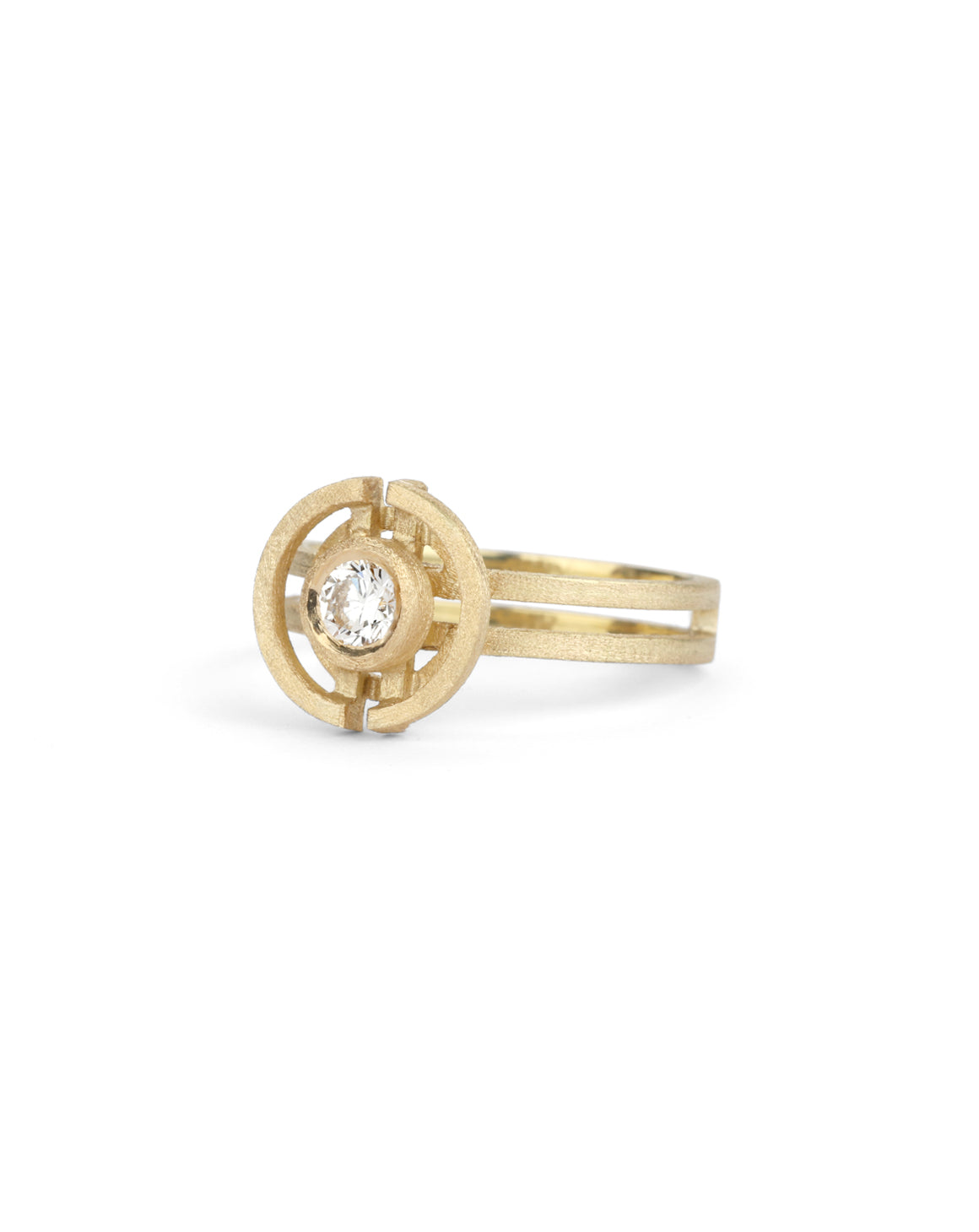 Geometric ring with a round white diamond and semicircle detail. 18ct yellow gold, textured finish.