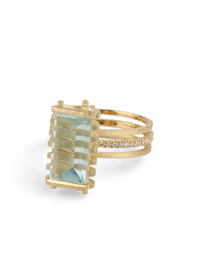 Mirror-cut aquamarine ring with diamond detail on the band, 18ct yellow gold, side profile.