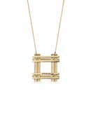 Geometric pendant with square structure detail and four tiny diamonds. 18ct yellow gold textured finish. Back detail.
