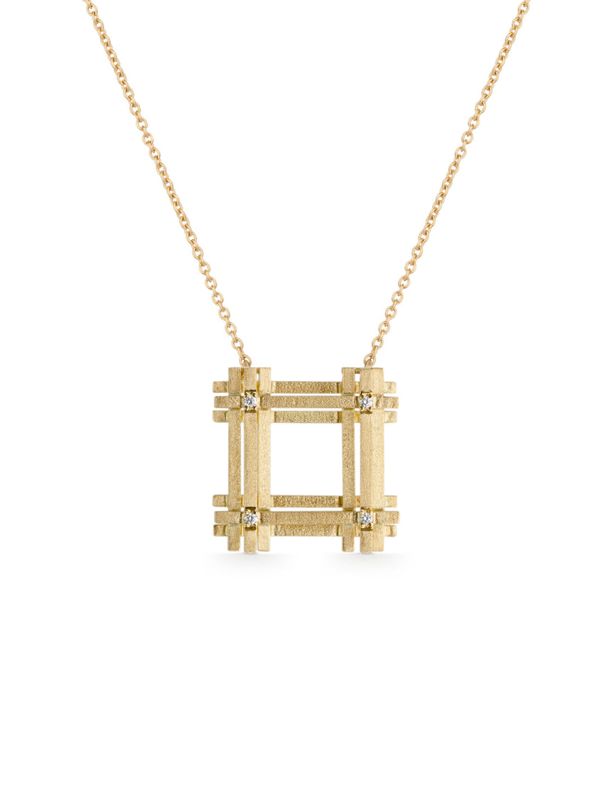 Geometric pendant with square structure detail and four tiny diamonds. 18ct yellow gold textured finish.
