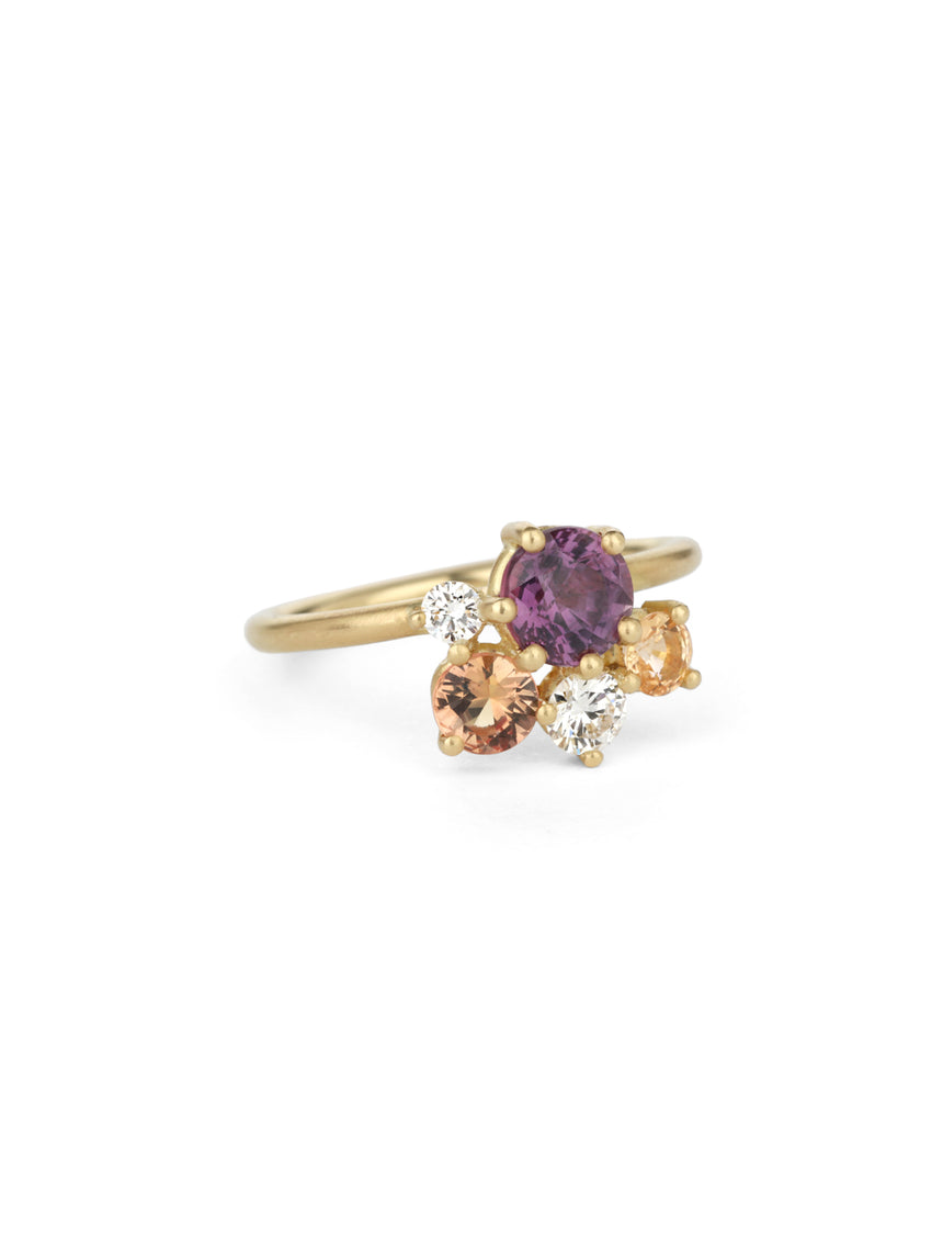 Cluster ring with purple and peach sapphires and white diamonds. 18ct yellow gold, satin finish.