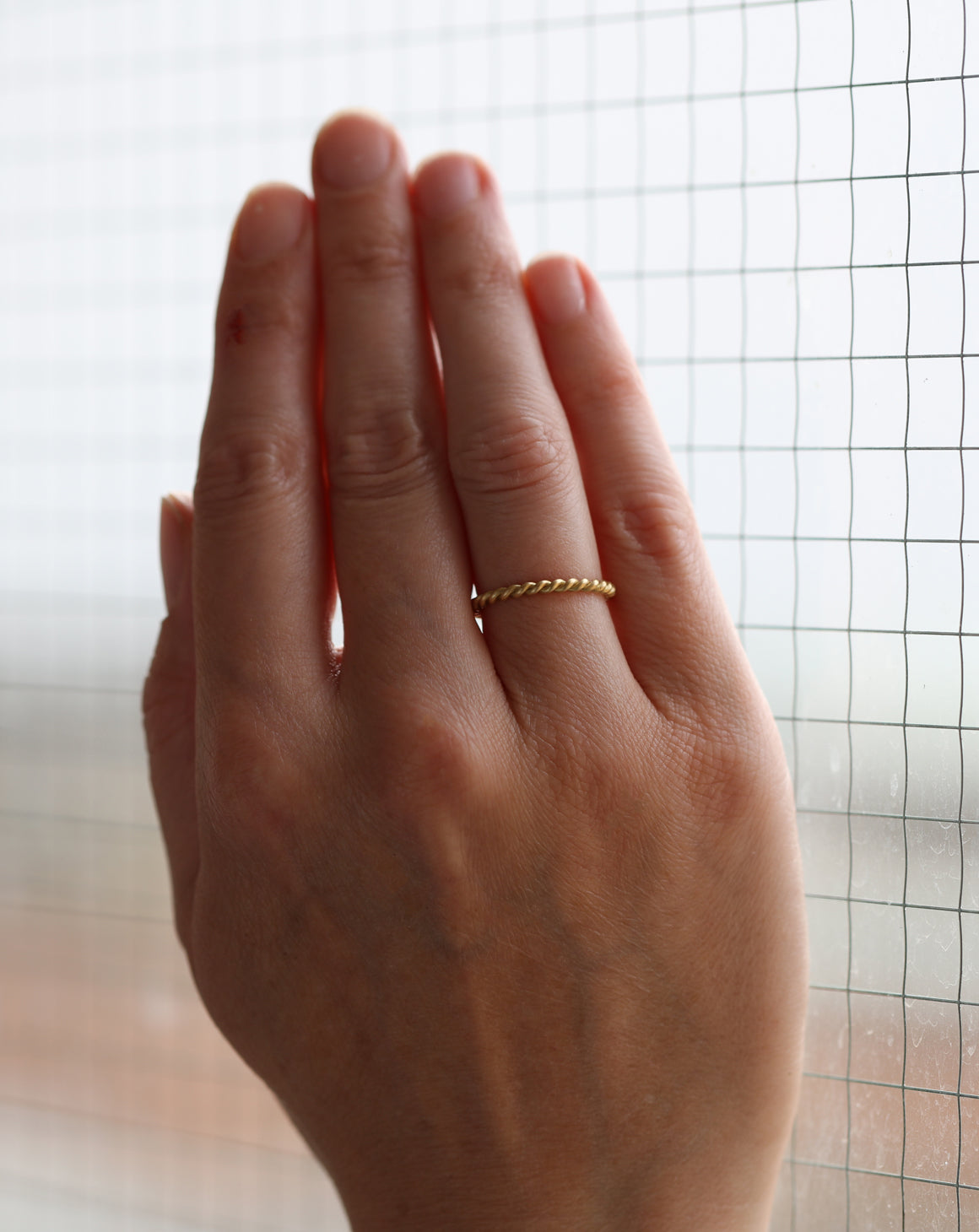 Rope style ring, 18ct yellow gold, satin finish. On hand.