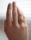 Geometric Ring with two concentric circles surrounding a yellow beryl. 18ct yellow gold, satin finish. On hand.