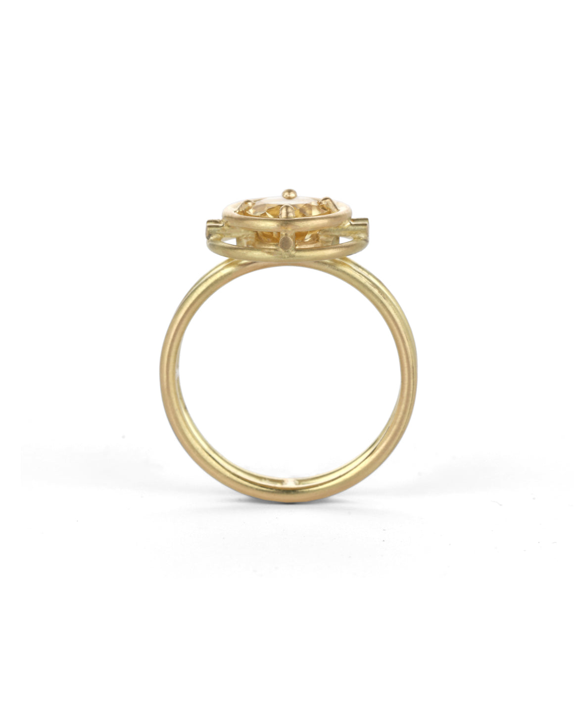 Geometric Ring with two concentric circles surrounding a yellow beryl. 18ct yellow gold, satin finish. Side view.