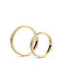 Two flat wedding bands. 18ct yellow gold, textured finish. Side view.